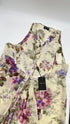 Top in seta a fiori con cartellino