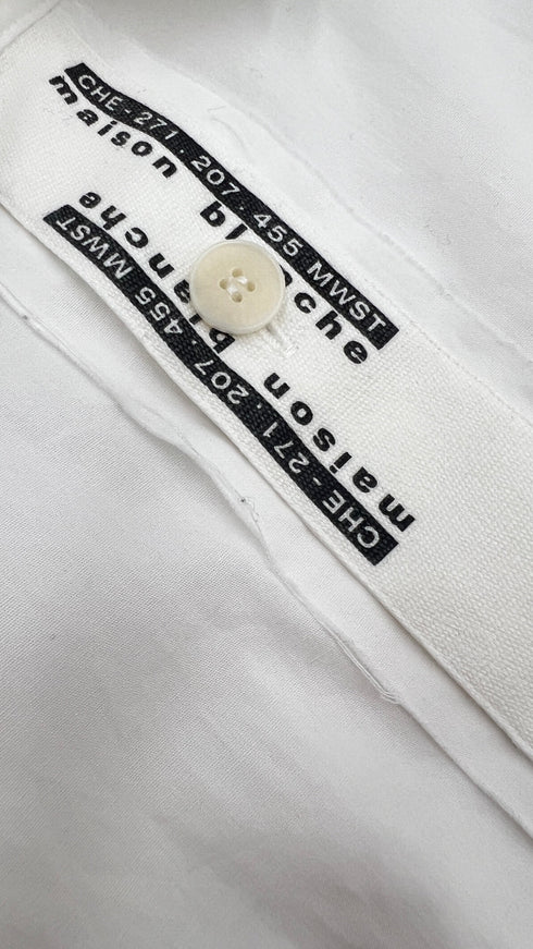 Camicia bianca asimmetrica