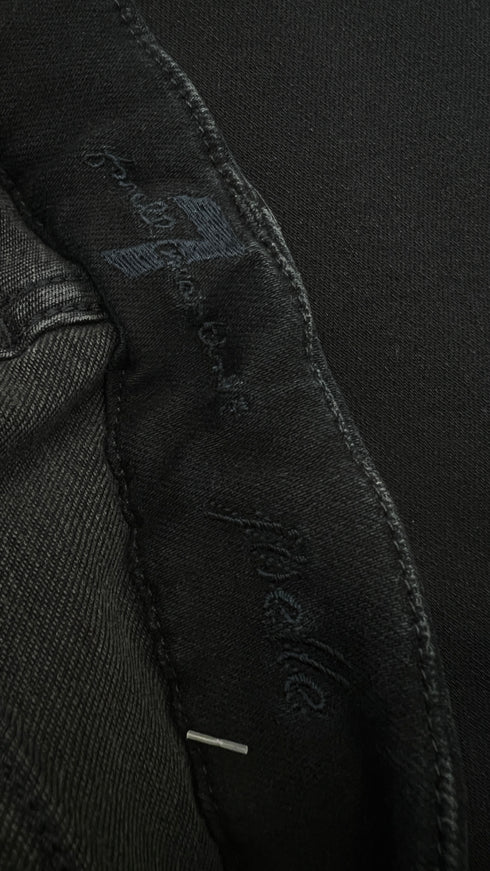 Jeans flare skinny con cartellino