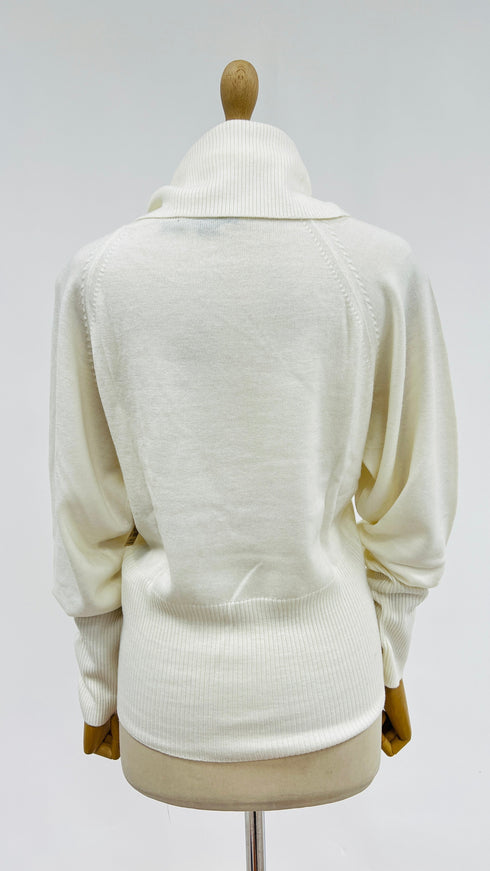 Dolcevita in lana con cartellino