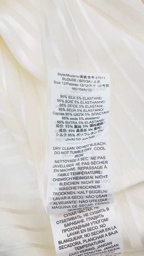 Camicia a rouches con cartellino