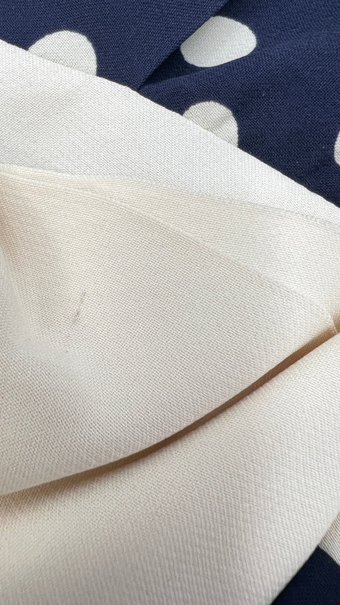 Abito corto a pois con fiocco