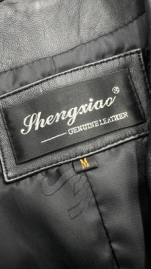 Abito smanicato in pelle