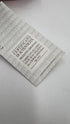 Top elegante con cartellino