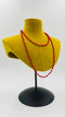 Collana lunga in perle rosse e metallo brunito
