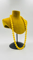 Collana con sfere gialle in resina lucida