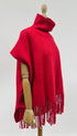 Poncho collo alto e frange