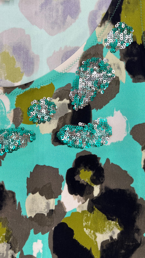 Top stampato con paillettes