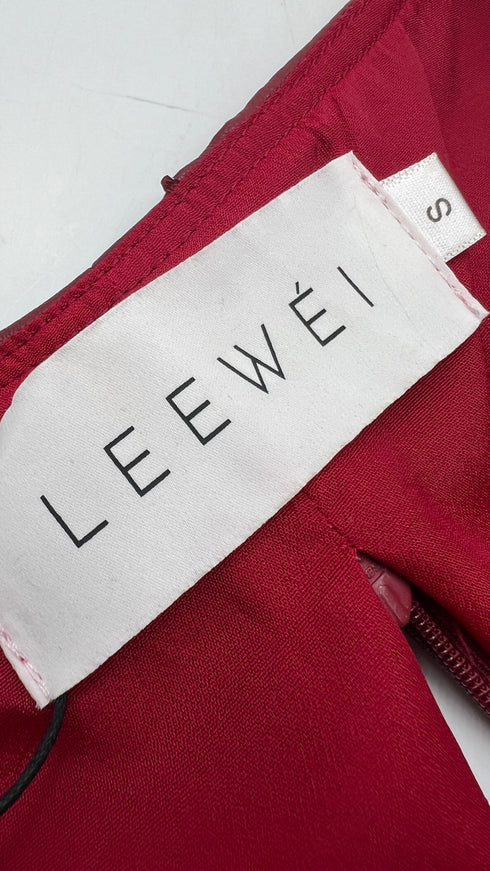 Top cropped in ecopelle con cartellino