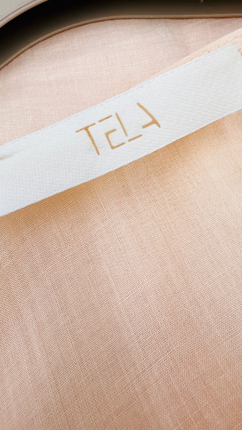 Top smanicato con volant