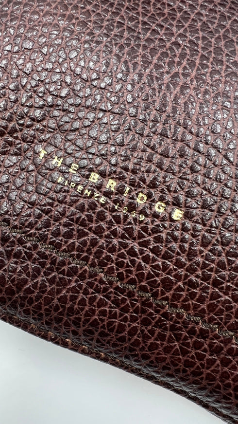 Pochette in pelle con cartellino