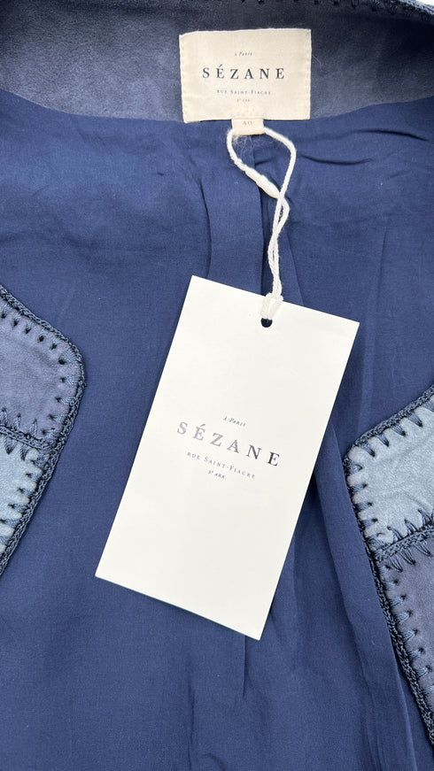 Gilet in suede con cartellino