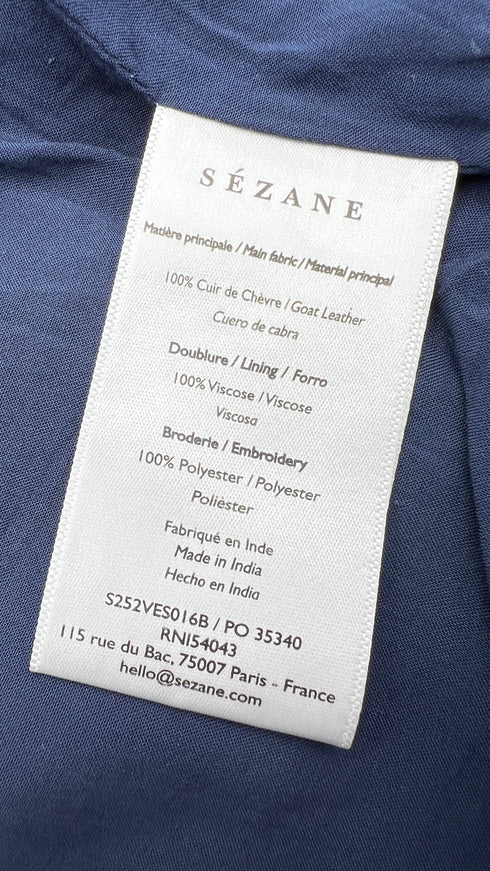 Gilet in suede con cartellino