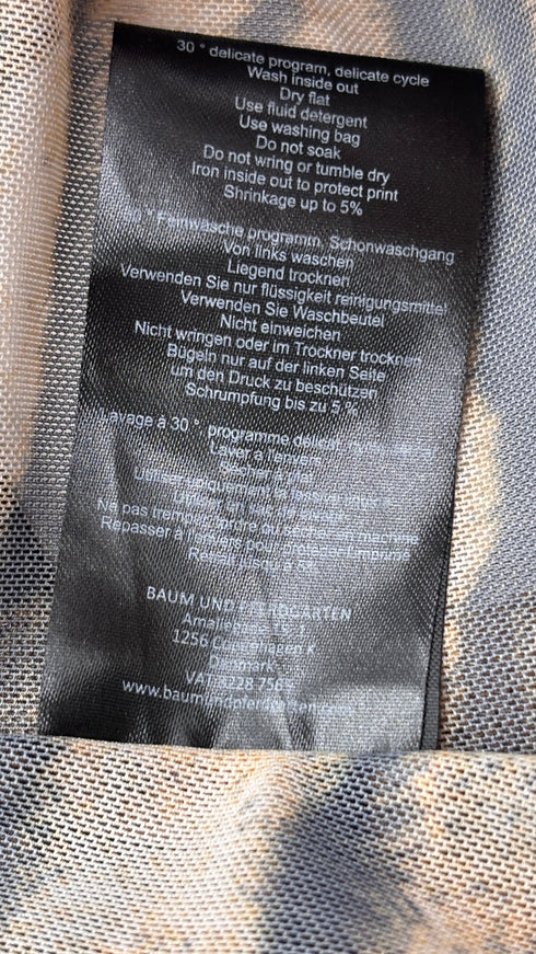 Leggings sheer animalier con cartellino