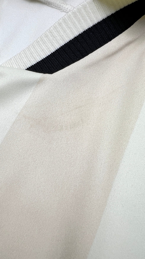 Polo a righe con cartellino