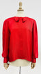Blusa rossa con fiocco
