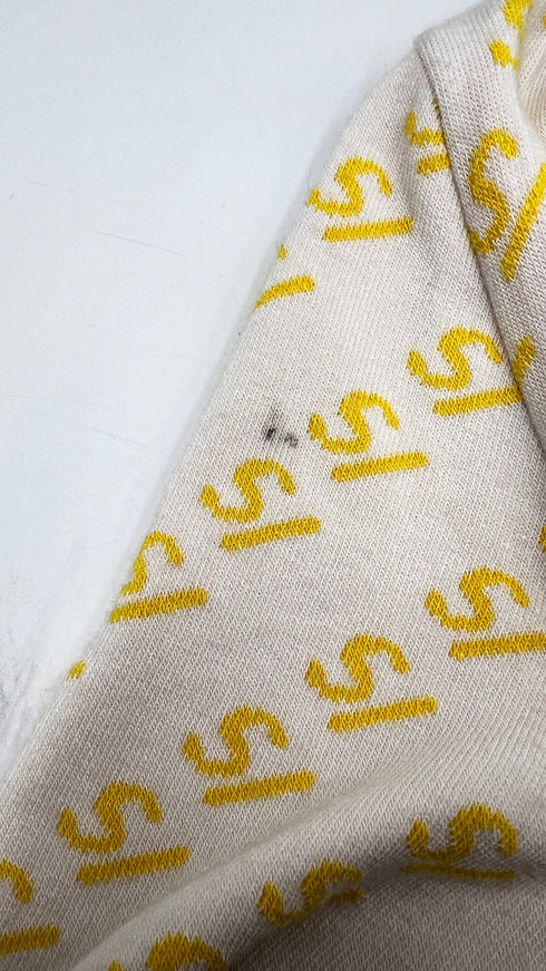 Cardigan corto con cartellino