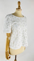 T-shirt con pizzo bianco