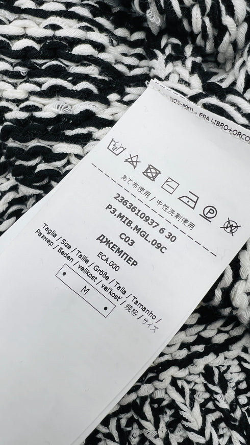 Maglione mélange con cartellino