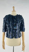 Bolero in pelle con cartellino