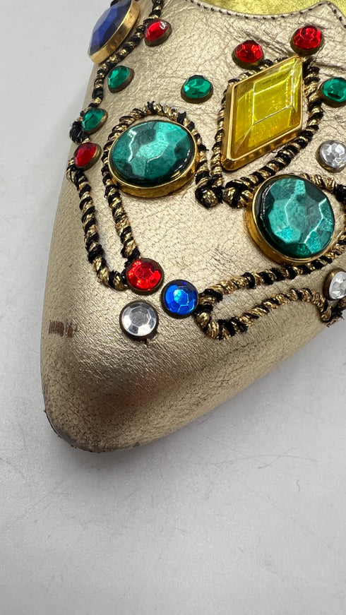 Décolleté dorate con appliqués