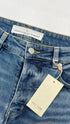Jeans slim con cartellino