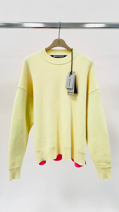 Maglione oversized con cartellino