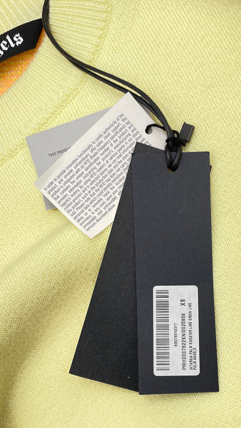 Maglione oversized con cartellino