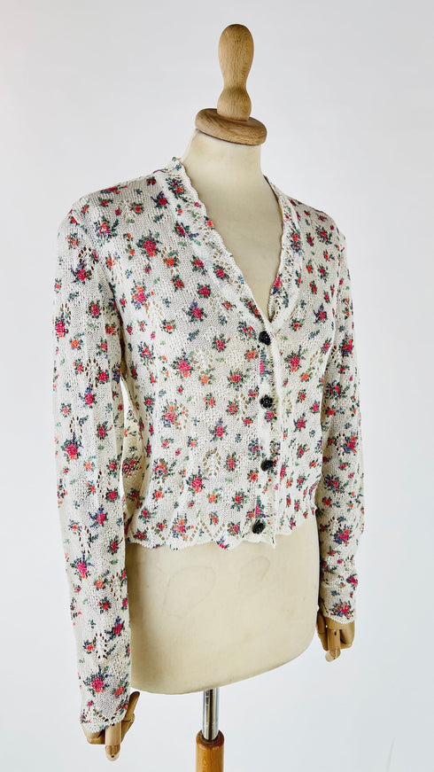 Cardigan floreale con bottoni gioiello