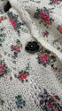 Cardigan floreale con bottoni gioiello