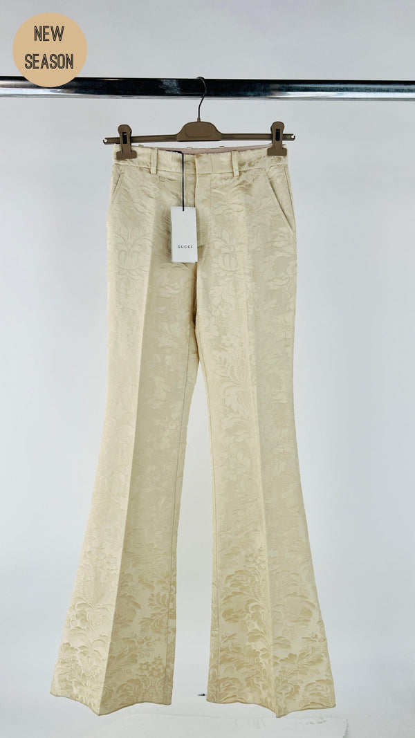 Pantaloni flared damascati con cartellino