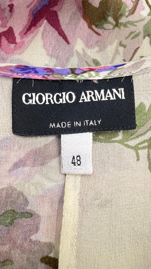 Top in seta a fiori con cartellino