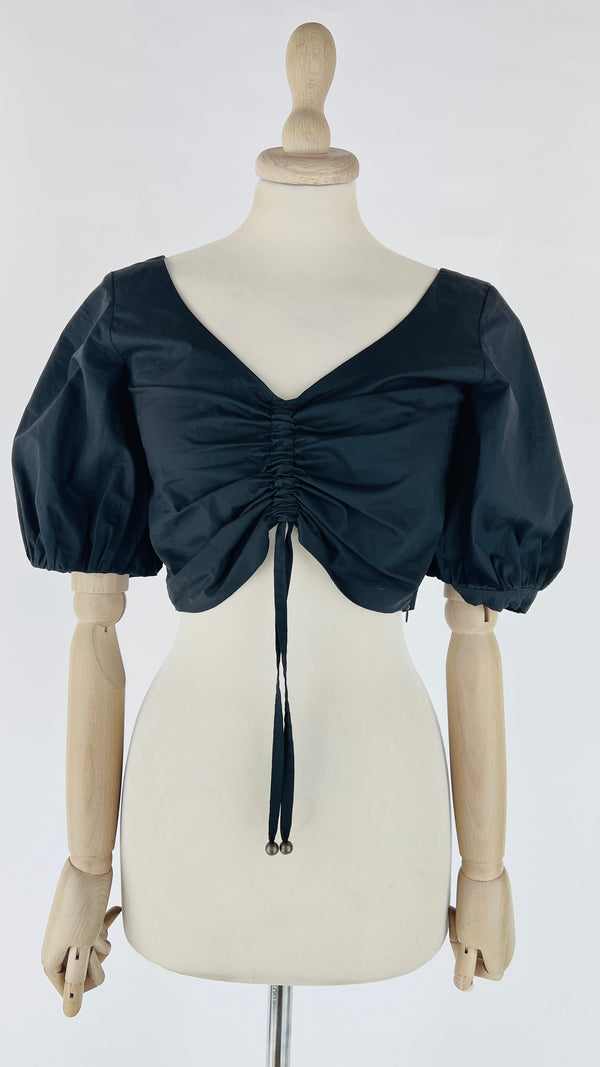 Crop top con cartellino