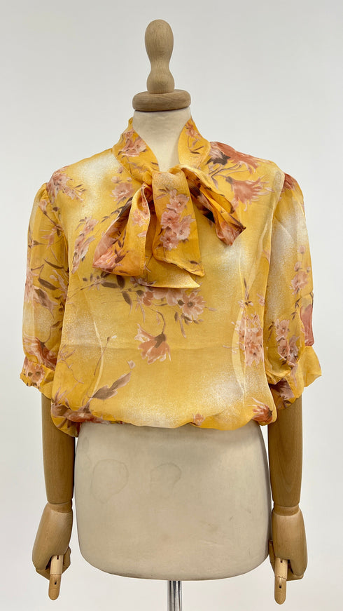 Blusa fiocco a fiori
