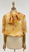 Blusa fiocco a fiori