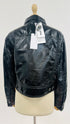 Giacca cropped con cartellino