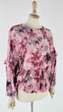 Blusa con volant stampa rami