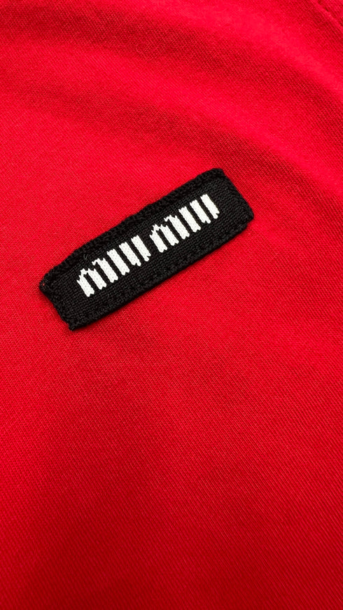 Top smanicato rosso