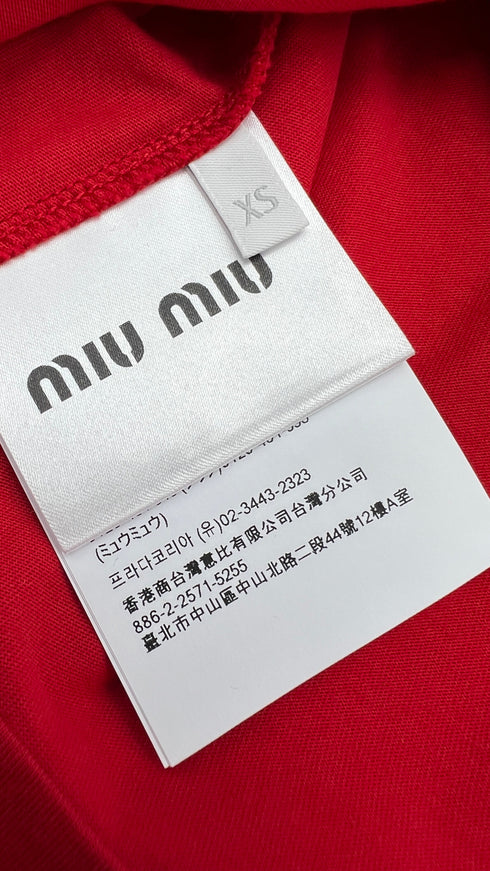 Top smanicato rosso