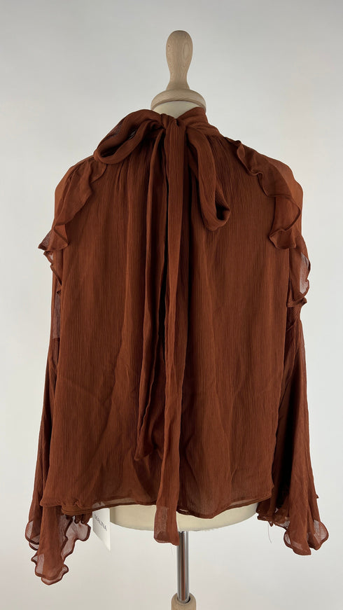 Blusa con fiocco e cartellino