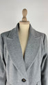 Cappotto con strass e cartellino