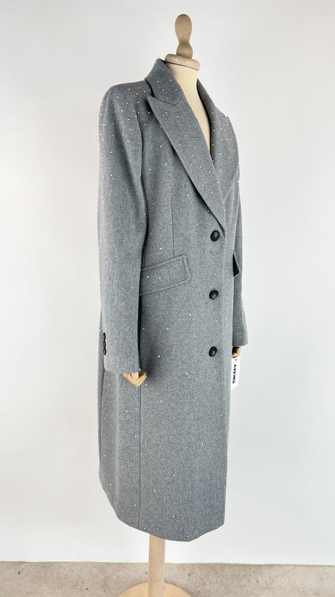 Cappotto con strass e cartellino