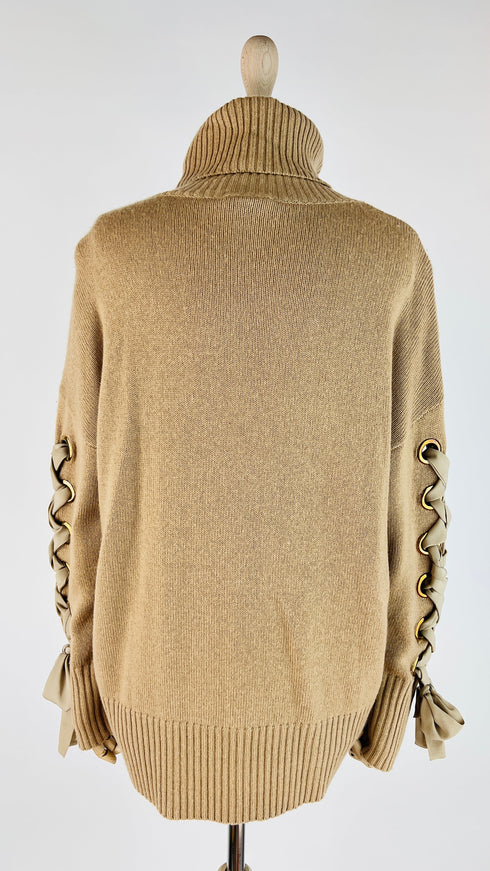 Dolcevita oversized con fiocchi