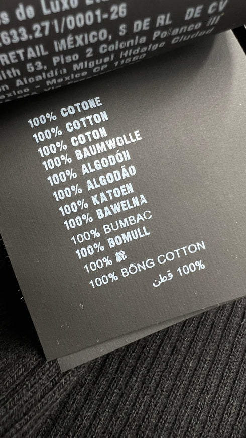 Dolcevita a costine con cartellino