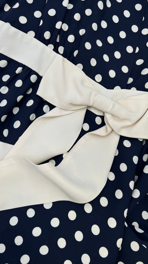 Abito corto a pois con fiocco