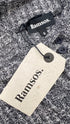 Top in maglia con cartellino
