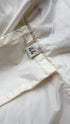 Piumino inserto pelle con cartellino