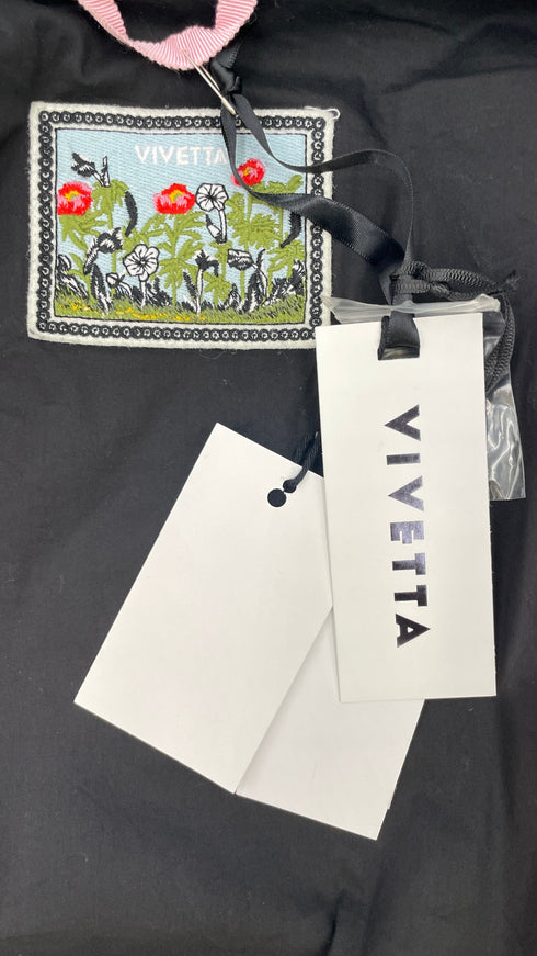 Giacca cropped con cartellino