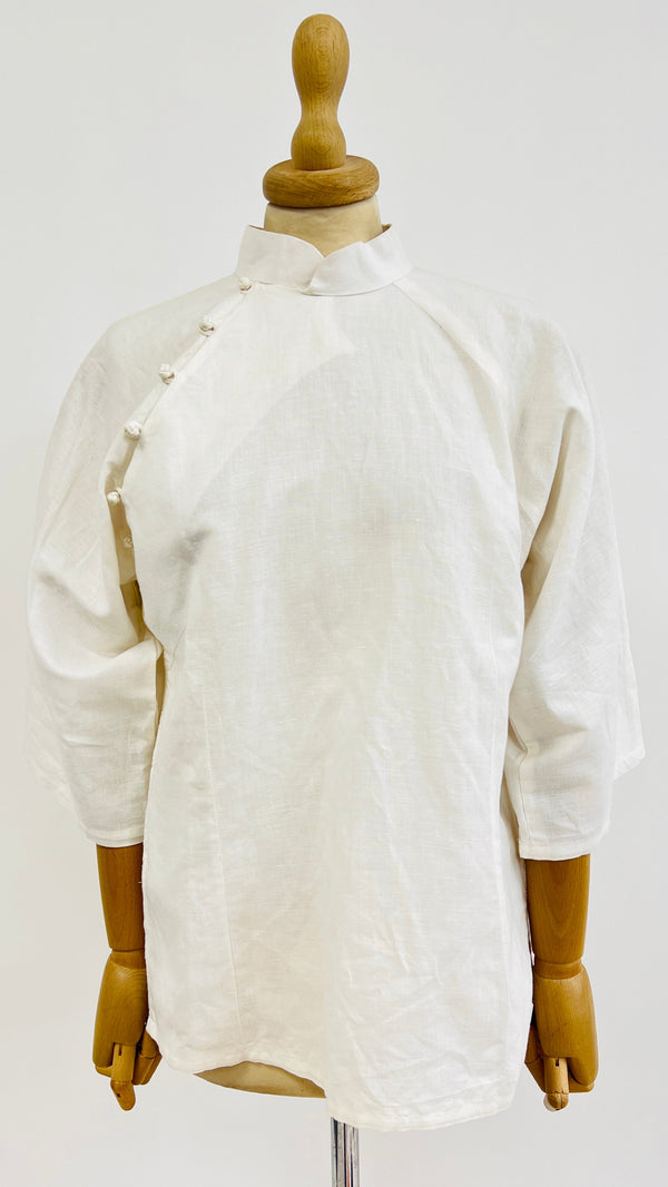 Camicia abbottonatura asimmetrica