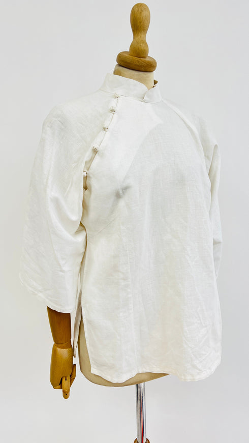 Camicia abbottonatura asimmetrica